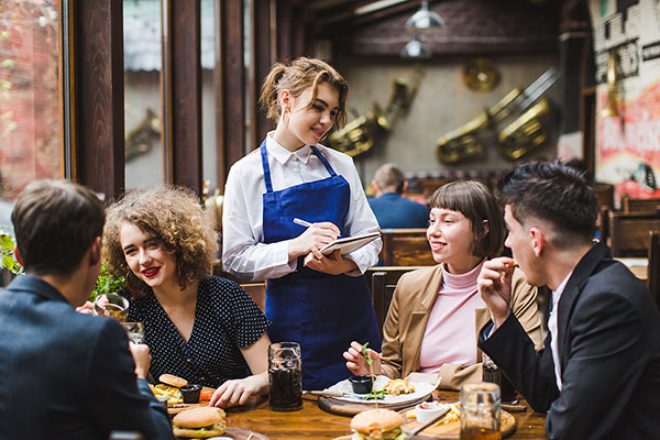 French waitress taking order 